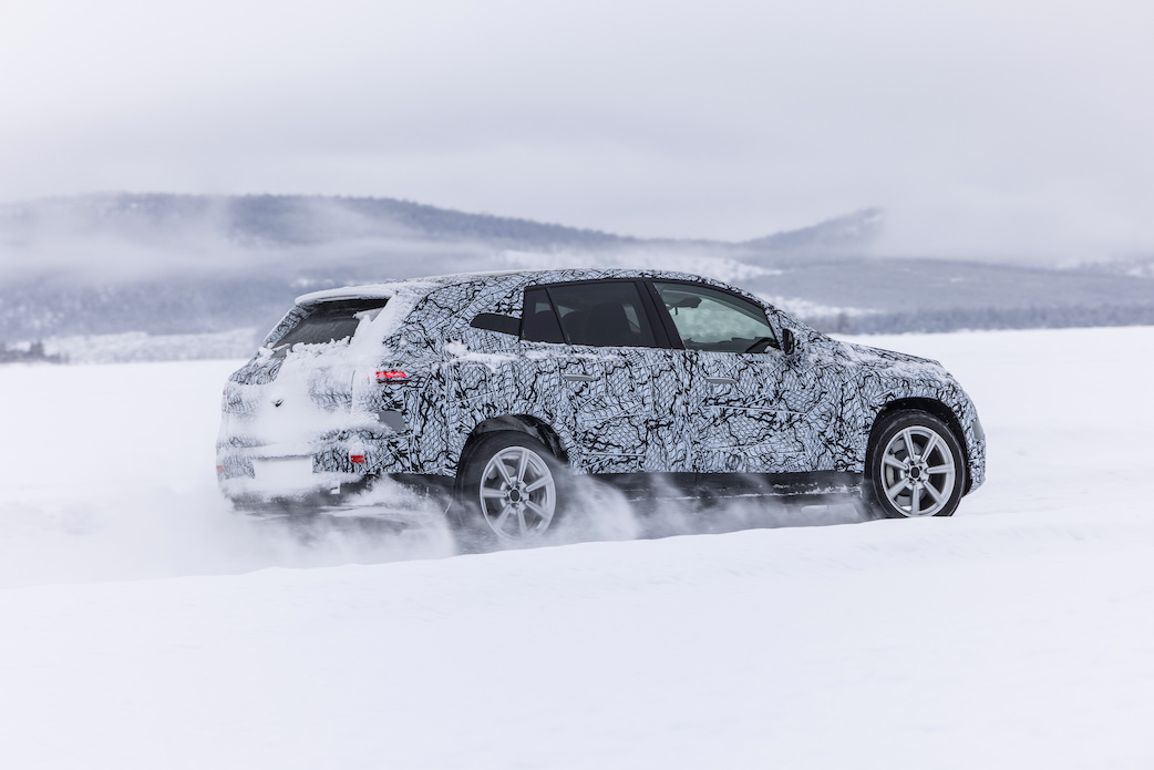 Mercedes EQS SUV  disguised prototype in snow, winter testing, rear/side view